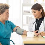 Woman getting her blood pressure taken