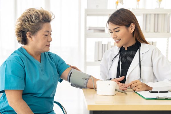 Woman getting her blood pressure taken