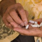 Older woman sorting medications