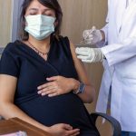 Pregnant woman getting a vaccine