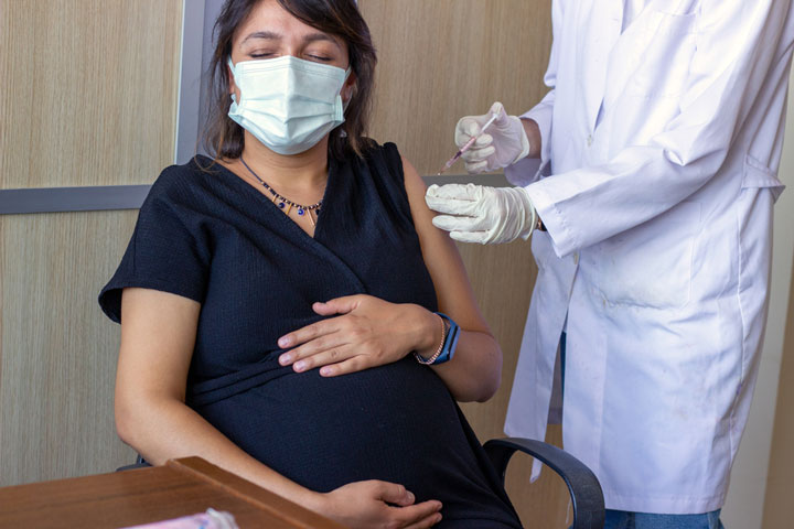 Pregnant woman getting a vaccine