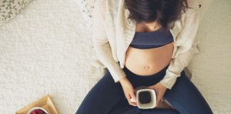 Pregnant woman with a cup of coffee