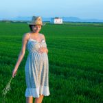 Pregnant woman in field