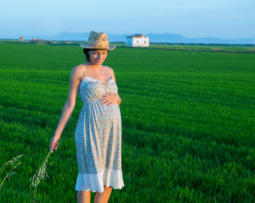 Pregnant woman in field