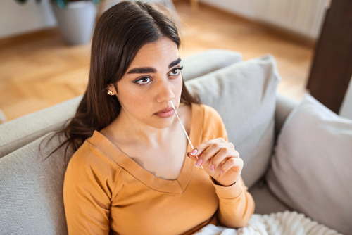 woman taking a rapid covid test