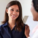 Nurse Practitioner talking to patient about Well-Woman Chart