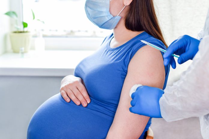 pregnant woman getting a covid vaccine