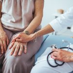 Nurse practitioner counseling an Alzheimer's patient