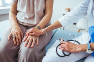 Nurse practitioner counseling an Alzheimer's patient