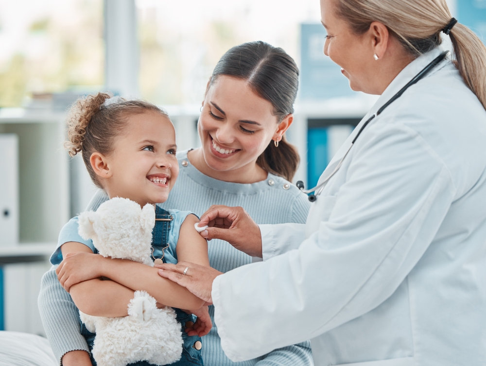 NP giving a toddler a vaccine